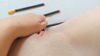 Sweet schoolgirl putting pencils very deep in her little snatch