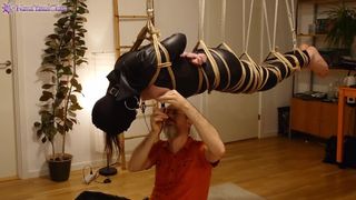 Bitch in leather catsuit gets Shibari energy tied, suspended, nipple clamps. Real uncut play!