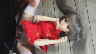 mini doll in a red dress two