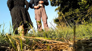 Mother-in-law in a new dress bends over and pisses in nature with her son-in-law