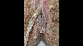 Yummy giant hairy snatch pissing from urethra close up