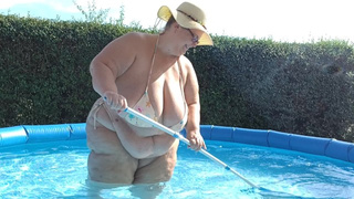 SSBBW with big natural boobies cleaning the pool in tiny bikini! By Viola Tittenfee
