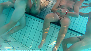 Cute girls masturbate in public nudist resorts with the underwater jet while other young couples fuck!